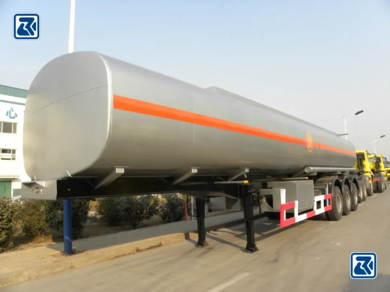 Front side view of a HOWO tanker truck displaying the tank and piping layout